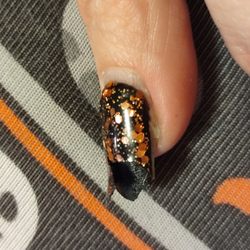 Us Nails And Spa - Polish split 2 weeks later. Gooey black underneath. Acrylic doesn't covers underneath nail. All were like this. Pic taken as I was removing