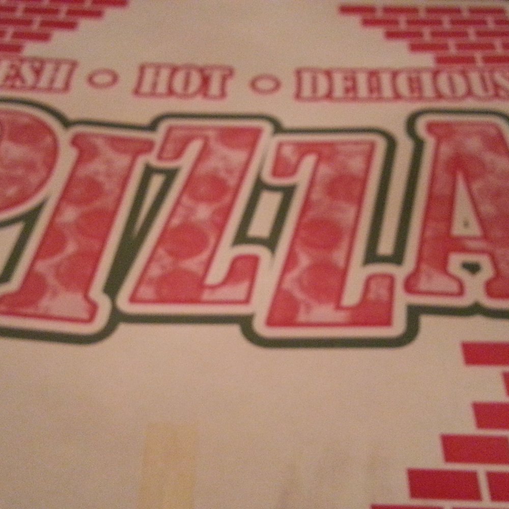 a pizza box with the word pizza on it