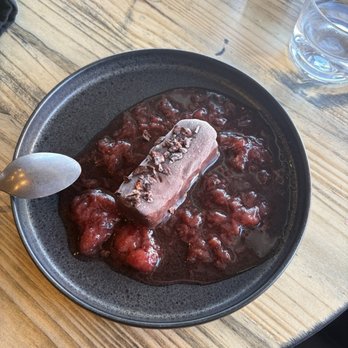 Pluto's Wine Bar - Chocolate dessert with strawberry puree - Tapas/Small Plates Near Me - Bastrop, Texas