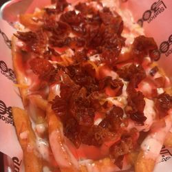 Station 300 - Loaded fries with extra bacon, homemade ranch dressing, shredded cheese, and queso.