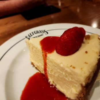 Saltgrass Steak House - a piece of cheesecake with a strawberry on top - Steakhouses Near Me - Plano, Texas Saltgrass Steak House - a piece of cheesecake with a strawberry on top - Steakhouses Near Me - Plano, Texas