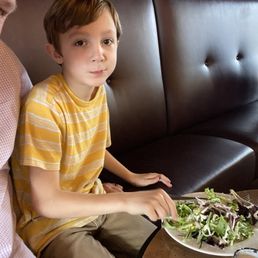 My boy enjoying my salad before the steak Fritz came out. My boy enjoying my salad before the steak Fritz came out.