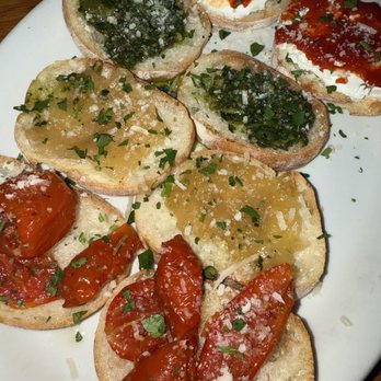 Adamo's - Bruschetta - left to right divana tomatoes, carmelized onion, basil pesto, and chèvre&jam - New American Near Me - Sacramento, California