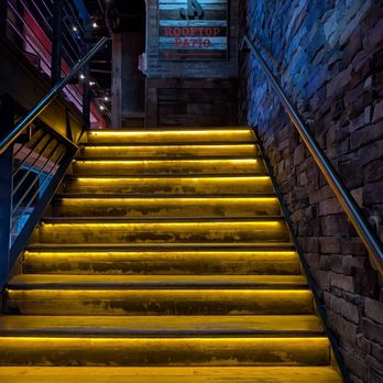 Jason Aldean's Kitchen + Rooftop Bar - I am into stairs as an architectural element. These are pretty nice. - Beer Bar Near Me - Nashville, Tennessee