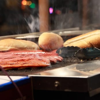 Monster Dogs - a hot dog being cooked on a grill - Hot Dogs Near Me - Seattle, Washington Monster Dogs - a hot dog being cooked on a grill - Hot Dogs Near Me - Seattle, Washington