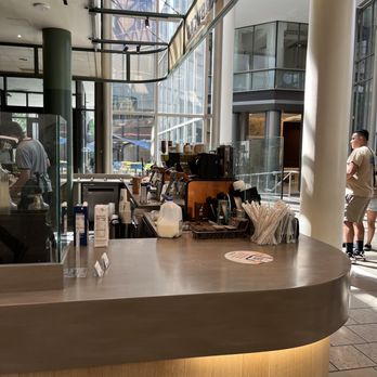 Starbucks - a coffee shop counter with people in the background - Coffee & Tea Near Me - Charlotte, North Carolina Starbucks - a coffee shop counter with people in the background - Coffee & Tea Near Me - Charlotte, North Carolina