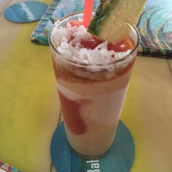 Bahama Breeze - Piña Colada with layers of strawberry syrup and rum, delicious!! - Bars Near Me - Miami, Florida