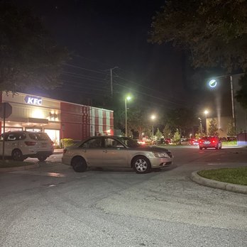 KFC - cars parked in a parking lot at night - Fast Food Near Me - Orlando, Florida KFC - cars parked in a parking lot at night - Fast Food Near Me - Orlando, Florida