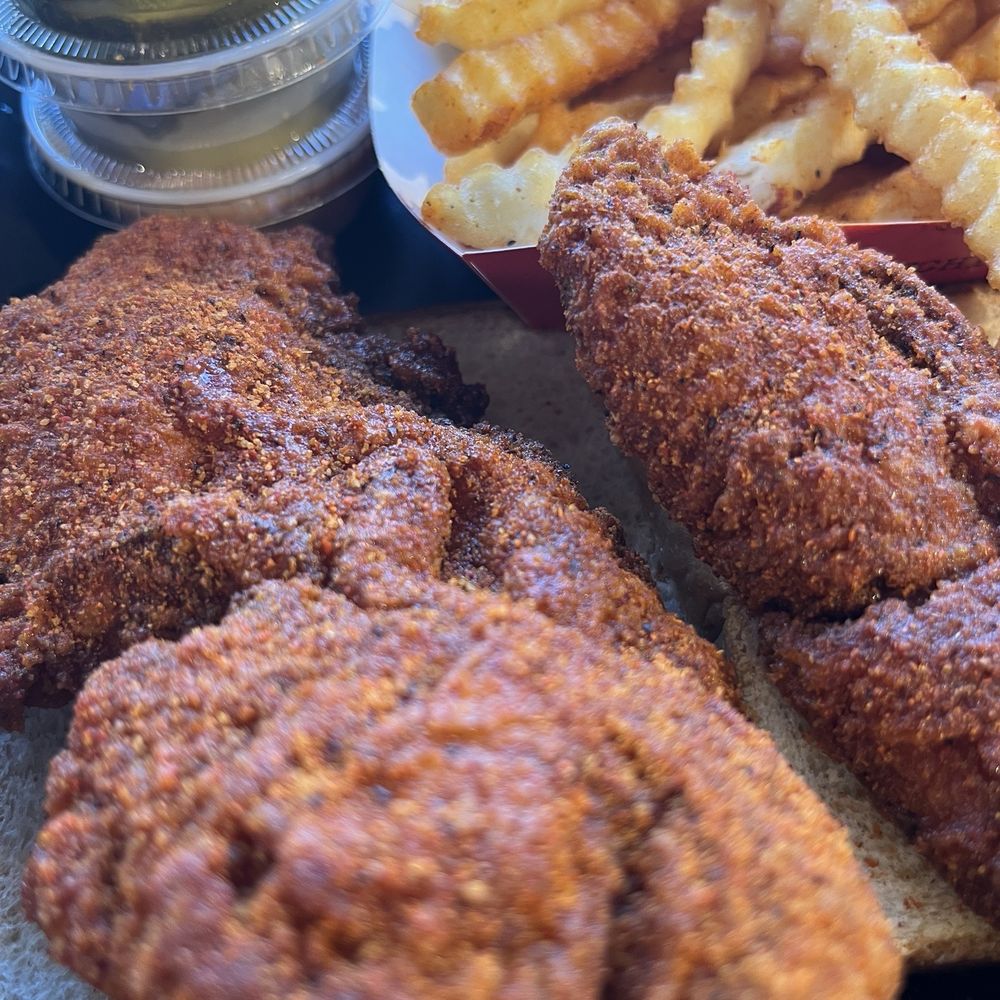Dave's Hot Chicken - Close up of that amazing extra hot chicken tender. - Chicken Shop Near Me - Clearwater, Florida Dave's Hot Chicken - Close up of that amazing extra hot chicken tender. - Chicken Shop Near Me - Clearwater, Florida