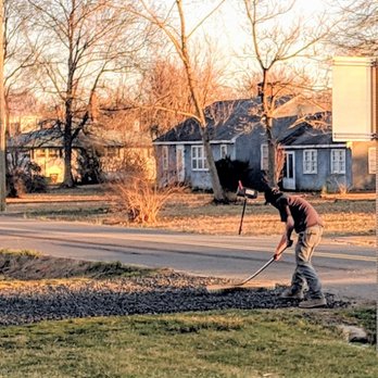 Groves Property Service - Dave puts the finishing touches on the gravel entryway - Landscaping Near Me Groves Property Service - Dave puts the finishing touches on the gravel entryway - Landscaping Near Me