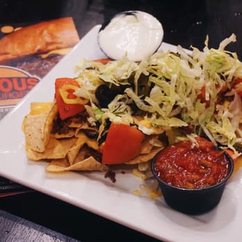 Famous Hamburger - Dearborn - Loaded Beef Nachos that come with a side of salsa and sour cream - Burgers Near Me - Dearborn, Michigan Famous Hamburger - Dearborn - Loaded Beef Nachos that come with a side of salsa and sour cream - Burgers Near Me - Dearborn, Michigan
