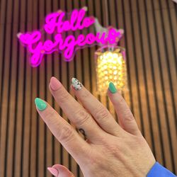 Sugar Nails Spa - Fresh mint tones and floral accents made perfect -- elevate your nails with a flawless pedicure in Queen Creek.