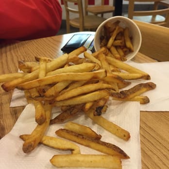 Five Guys - This is the REGULAR (single) fry.... delicious but oh so much! They fill this heaping cup AND dump another cup in the bag. Tons! - Fast Food Near Me - Huntersville, North Carolina