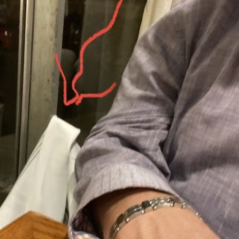 The Hideout Kitchen - Red arrow shows original napkin draped over protruding screw. - New American Near Me - Lafayette, California