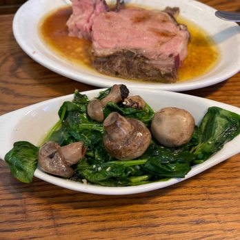 Lucky's Steak House - Prime rib with sautéed spinach - Steakhouses Near Me - Bay City, Michigan