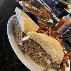 J.R. Cash's Grill and Bar - Prime Rib Sandwich, Sweet Potato Fries, and crispy onions straws.
