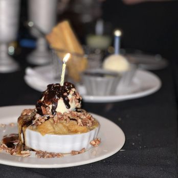 Chimayo - a dessert with a candle on top - New American Near Me - Park City, Utah Chimayo - a dessert with a candle on top - New American Near Me - Park City, Utah