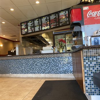 Open Kitchen - the counter and seating area of a restaurant - Chinese Near Me - Redlands, California Open Kitchen - the counter and seating area of a restaurant - Chinese Near Me - Redlands, California