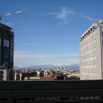 Hyatt Centric Milan Centrale - View from rooftop bar of Alps on a clear April day. - Hotels Near Me - Milan, Michigan