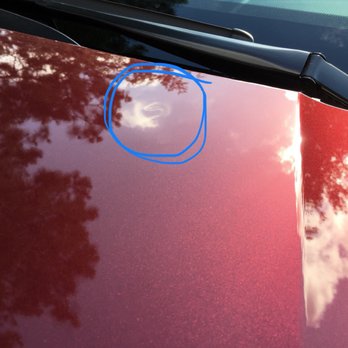 Hail Lions - Ding in hood up by wipers, before - Body Shops Near Me - Kingwood, Texas