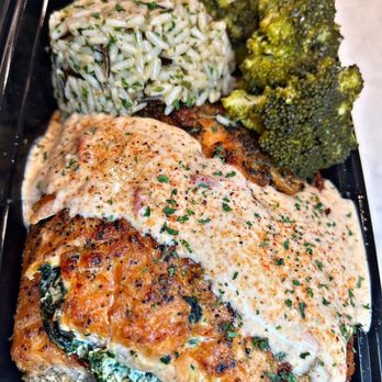 Milli’s Joint - Stuffed salmon food prep plate - Caterers Near Me