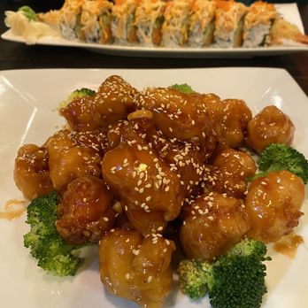 Ikoi - Sesame chicken and sushi roll in background - Sushi Bars Near Me - Bloomfield, Connecticut Ikoi - Sesame chicken and sushi roll in background - Sushi Bars Near Me - Bloomfield, Connecticut