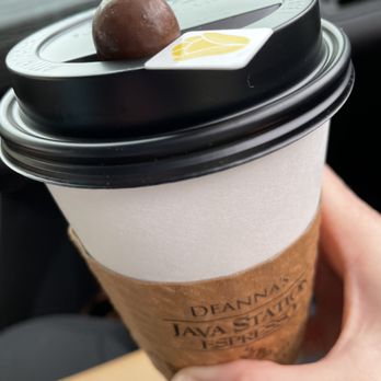 Deanna's Java Station - a hand holding a coffee cup - Coffee & Tea Near Me - Clinton, Iowa