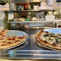 Poppy’s Bagels & More - Pizzas by the slice on display
