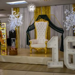 Queens Event Venue - Throne chair or couch come standard and a stage backdrop color of your choice.