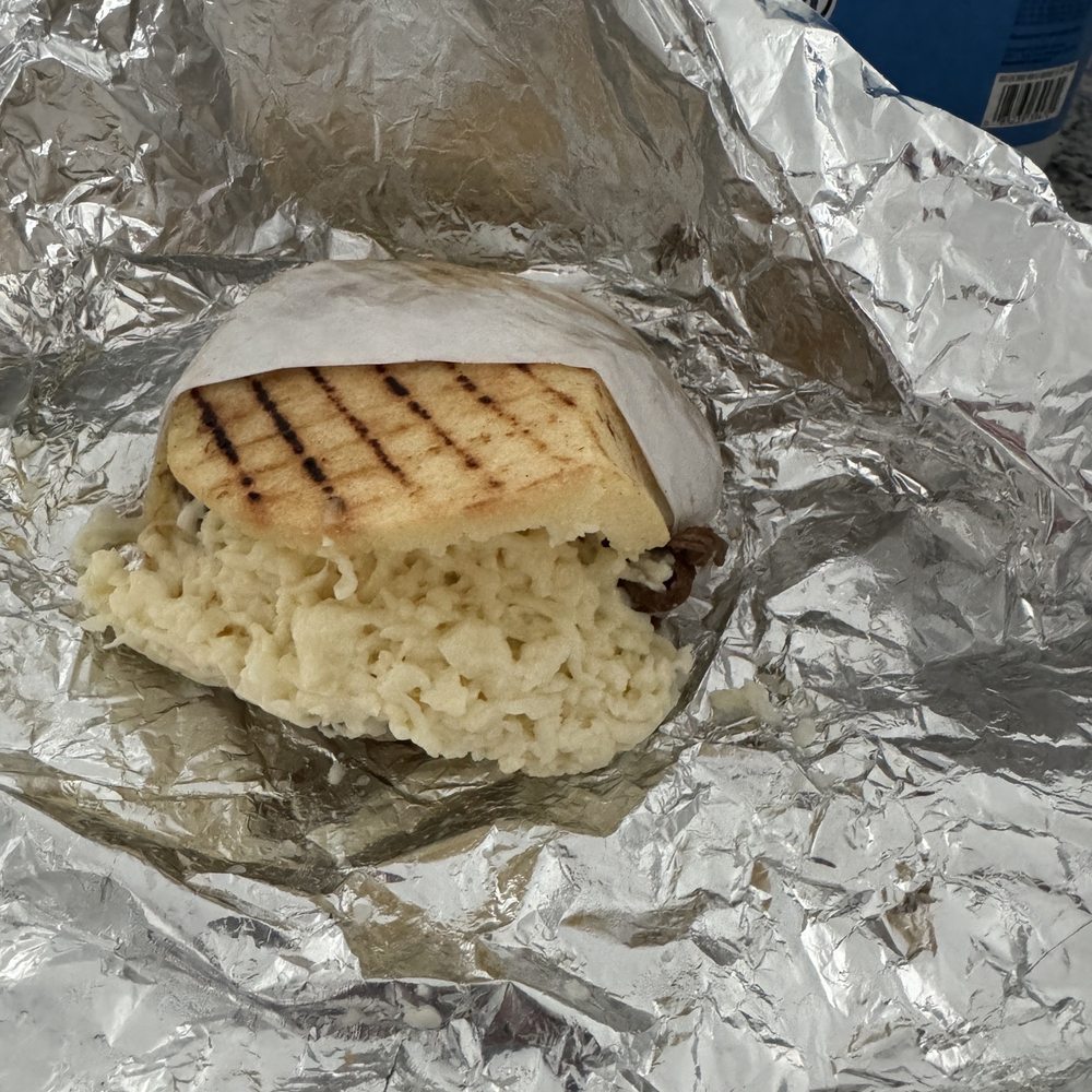 The Arepa Station - Shredded beef with shredded white cheese - Latin American Near Me - Orlando, Florida The Arepa Station - Shredded beef with shredded white cheese - Latin American Near Me - Orlando, Florida