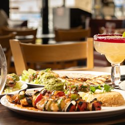 El Diablo Mexican restaurant - A spread of Mexican dishes and drinks served on a table in a brightly lit restaurant setting
