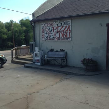 Larkspur Corner Market - a bench in front of a building - Grocery Near Me - Larkspur, Colorado