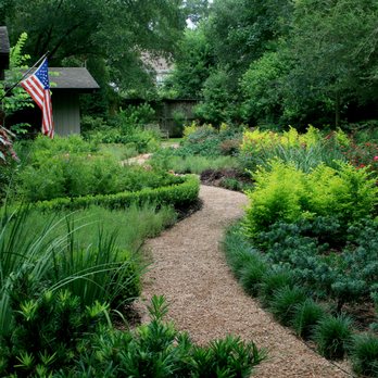 Moss Landscaping - Incredible biodiversity and textural contrast make for this stunning stroll through a gorgeous garden, created by our in-house design team. - Tree Services Near Me - Houston, Texas