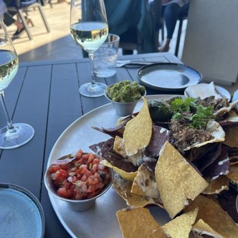 Hay's Place - Tin Can Nachos with wine - Mexican Near Me - Pebble Beach, California Hay's Place - Tin Can Nachos with wine - Mexican Near Me - Pebble Beach, California