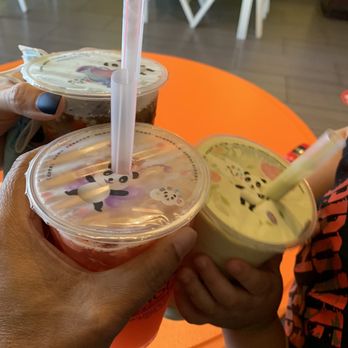 HANGOUT fruit juices & bites - two people holding drinks - Juice Bars & Smoothies Near Me - Houston, Texas