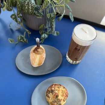 Social Fabric - Bacon and egg frittata (bottom), bombolini tiramisu (left) and the cardamom rose americano (right). - Gelato Near Me - Seattle, Washington