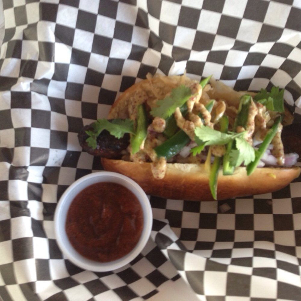 Moon Tower - The lamb with garlic and white wine. Atop creole mustard, stout beer sour kraut, onions, and jalapeños. Pepper ketchup side. - Dive Bars Near Me - Houston, Texas Moon Tower - The lamb with garlic and white wine. Atop creole mustard, stout beer sour kraut, onions, and jalapeños. Pepper ketchup side. - Dive Bars Near Me - Houston, Texas