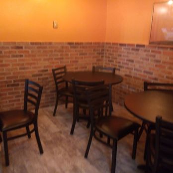 Frontier Pizza - tables and chairs in a restaurant - Chicken Wings Near Me - Houston, Texas