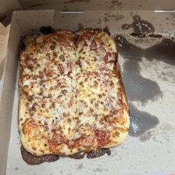 Little Caesars Pizza - What's supposed to be a deep dish pizza. Definitely not what I ordered. Nothing deep about this pizza