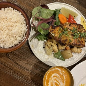 Bajeko Sekuwa - My order was Himalayan Salmon - cooked perfectly with crispy skin  Sauce compliments salmon and vegetables so well - Himalayan/Nepalese Near Me - Sunnyside, New York