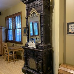 Inn At Union Pier - An antique Swiss chimney of the type the owners put in the lobby and each room of the Inn