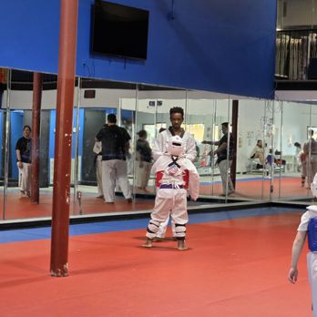 Legacy Martial Arts - Coach demonstrating the next move - Taekwondo Near Me - Irmo, South Carolina Legacy Martial Arts - Coach demonstrating the next move - Taekwondo Near Me - Irmo, South Carolina