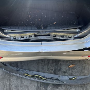 Long Beach Collision Center - Rear-end collision damage: bumper detached, frame bent, and trunk misaligned. - Body Shops Near Me - Long Beach, California