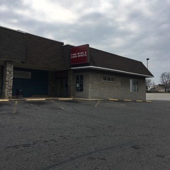 Fine Wine & Good Spirits - Outside tucked behind a shopping center near goodwill - Beer, Wine & Spirits Near Me - Holmes, Pennsylvania