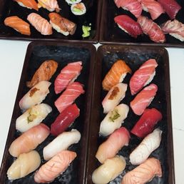 Omakase platters (bottom), salmon omakase (top left), tuna omakase (top right) Omakase platters (bottom), salmon omakase (top left), tuna omakase (top right)