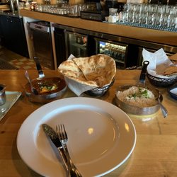 Chicken Tiki Masala with a side of samosas.