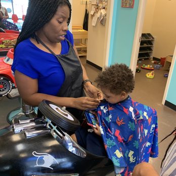 Ms Lisa's Cuts for Kids - Kahleelah getting the little guy ready - Hair Salons Near Me - Decatur, Georgia Ms Lisa's Cuts for Kids - Kahleelah getting the little guy ready - Hair Salons Near Me - Decatur, Georgia