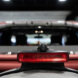 Audio Realm - Acumen front & rear dash cam installed on this Jeep Wrangler with a clean rear camera mount above the spare tire. Full coverage, clean look.