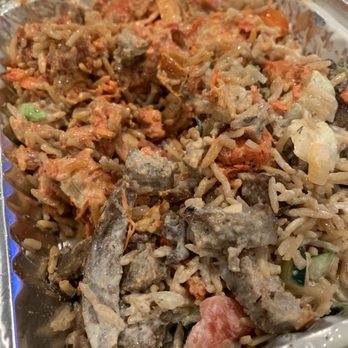 Shah’s Halal Food - Got to the middle layer of the platter, white sauce now blended mostly with the rice and proteins. - Halal Near Me - Commack, New York