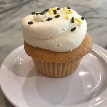 Molly's Cupcakes - A perfectly vanilla cupcake (with Hawkeye sprinkles)! - Bakeries Near Me - Iowa City, Iowa Molly's Cupcakes - A perfectly vanilla cupcake (with Hawkeye sprinkles)! - Bakeries Near Me - Iowa City, Iowa